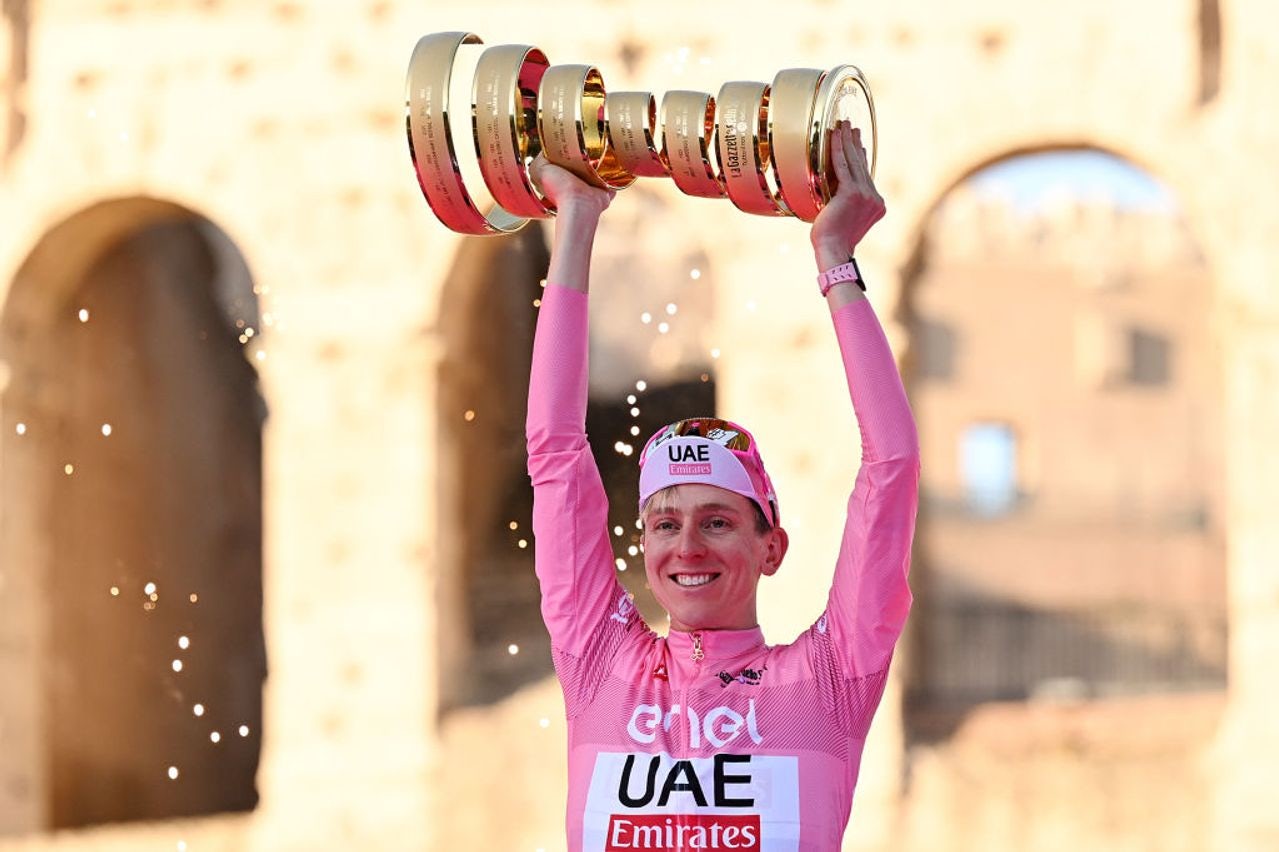 Tadej Pogačar lifts the Giro d'Italia trophy in Rome